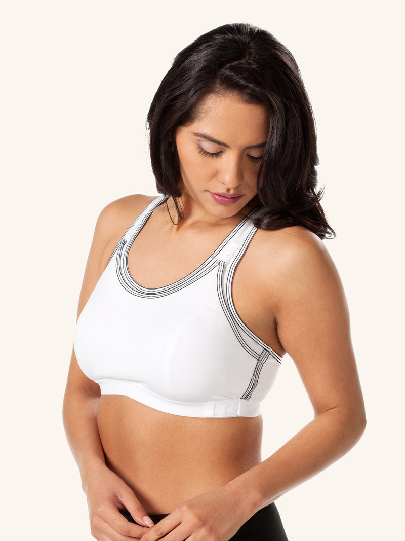 Back view of maternity to nursing adjustable sports bra in white